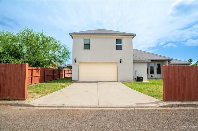 607 Gable Dr, Pharr, TX 78577 - view of front of property featuring a garage, stucco siding, driveway, and cooling unit
