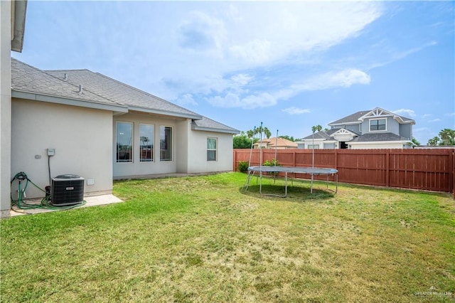 607 Gable Dr, Pharr, TX 78577 - view of yard featuring cooling unit and a trampoline