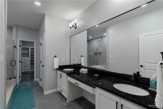 bathroom featuring vanity and a shower with shower door