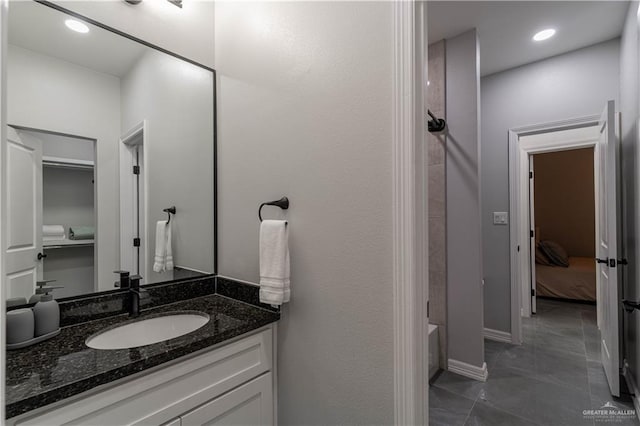 bathroom featuring vanity and washtub / shower combination