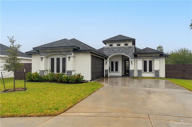 view of front facade featuring a garage and a front lawn