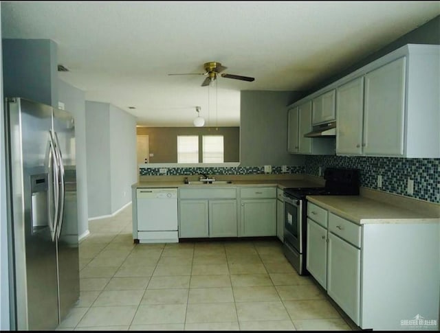2246 Llano Grande Ln, Edinburg, TX 78542 - kitchen with a ceiling fan, tasteful backsplash, a sink, stainless steel appliances, and under cabinet range hood