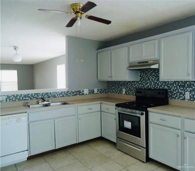 2246 Llano Grande Ln, Edinburg, TX 78542 - kitchen with a sink, electric range, decorative backsplash, dishwasher, and under cabinet range hood