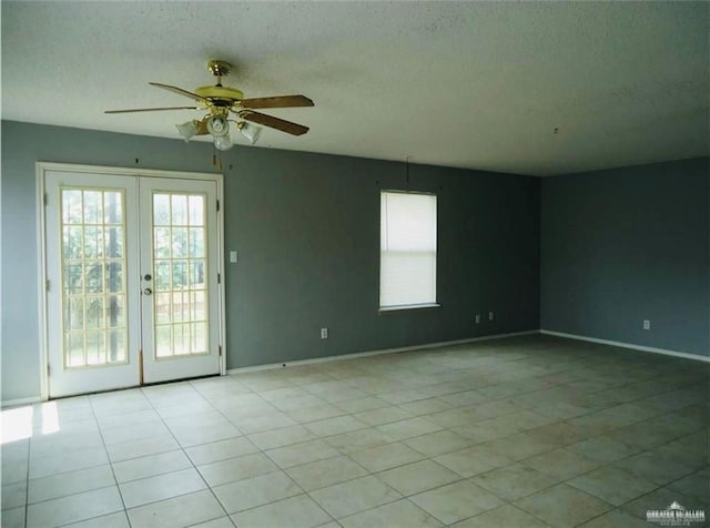 2246 Llano Grande Ln, Edinburg, TX 78542 - empty room featuring light tile patterned flooring, a healthy amount of sunlight, a ceiling fan, and french doors