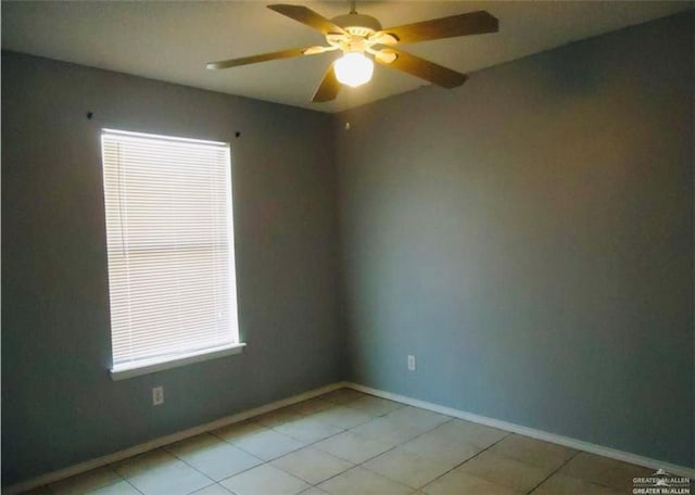 2246 Llano Grande Ln, Edinburg, TX 78542 - empty room featuring light tile patterned floors, baseboards, and ceiling fan