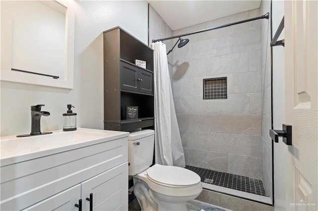 bathroom with vanity, toilet, and a shower with shower curtain