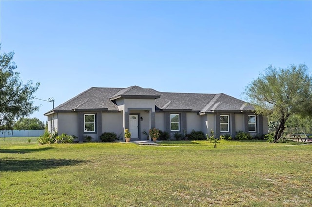 ranch-style house featuring a front lawn