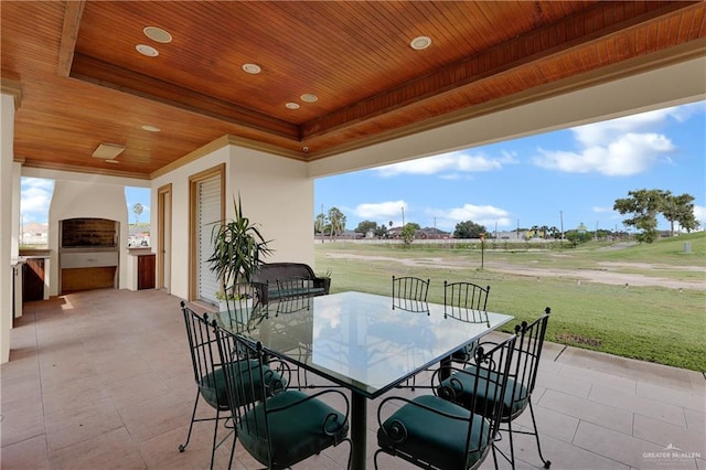 view of patio featuring exterior fireplace