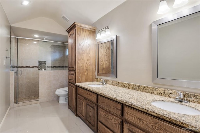 bathroom featuring tile patterned floors, toilet, an enclosed shower, vaulted ceiling, and vanity