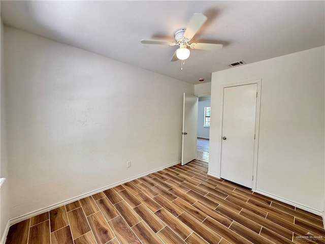 1313 Royal Palm St, Alamo, TX 78516 - spare room featuring dark wood-style flooring, ceiling fan, and baseboards
