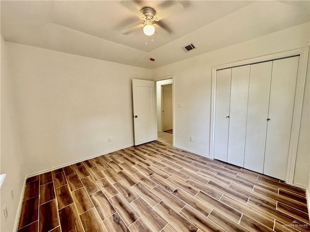 1313 Royal Palm St, Alamo, TX 78516 - unfurnished bedroom featuring light wood-style flooring, a closet, ceiling fan, and baseboards