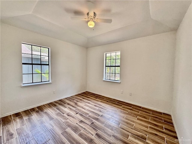 1313 Royal Palm St, Alamo, TX 78516 - empty room with wood finish floors, ceiling fan, and a raised ceiling