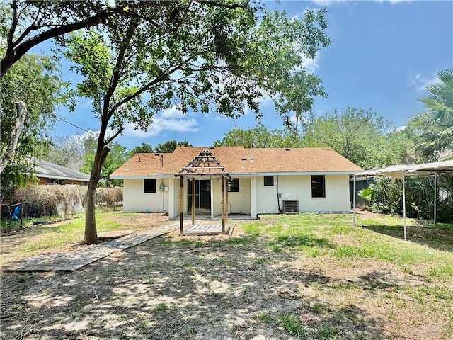 1313 Royal Palm St, Alamo, TX 78516 - rear view of property with central air condition unit