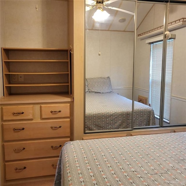 bedroom featuring ceiling fan and a closet