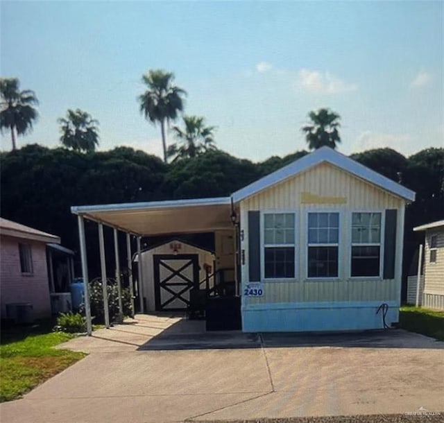 view of front of home with a carport