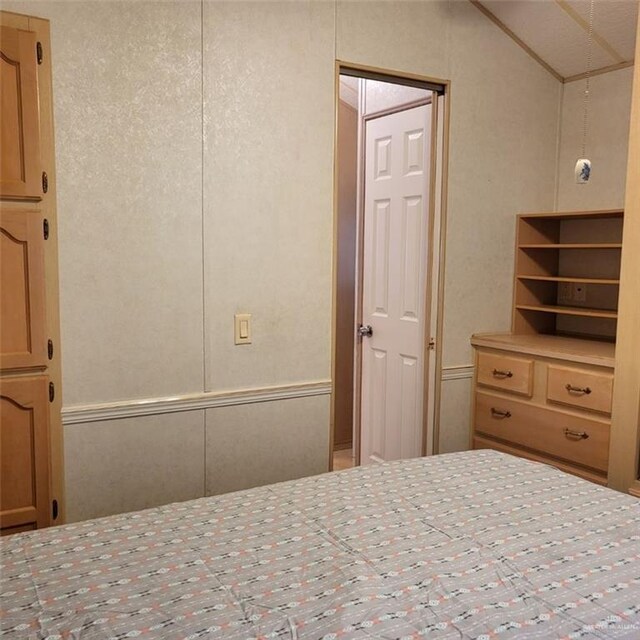 unfurnished bedroom featuring vaulted ceiling