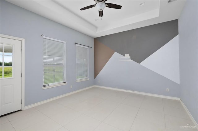 23309 Tangerine Ave, Harlingen, TX 78552 - tiled spare room with a ceiling fan and a tray ceiling