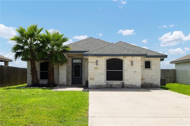 23309 Tangerine Ave, Harlingen, TX 78552 - view of front of property featuring roof with shingles and stone siding