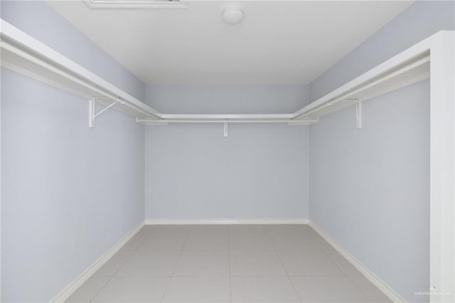 23309 Tangerine Ave, Harlingen, TX 78552 - walk in closet featuring tile patterned floors