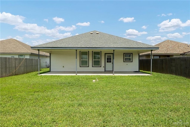 23309 Tangerine Ave, Harlingen, TX 78552 - rear view of property with roof with shingles, a fenced backyard, and a patio area