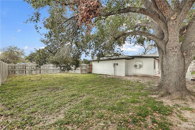 view of yard with a fenced backyard