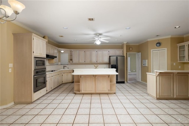 kitchen with visible vents, a center island, light countertops, black appliances, and open shelves