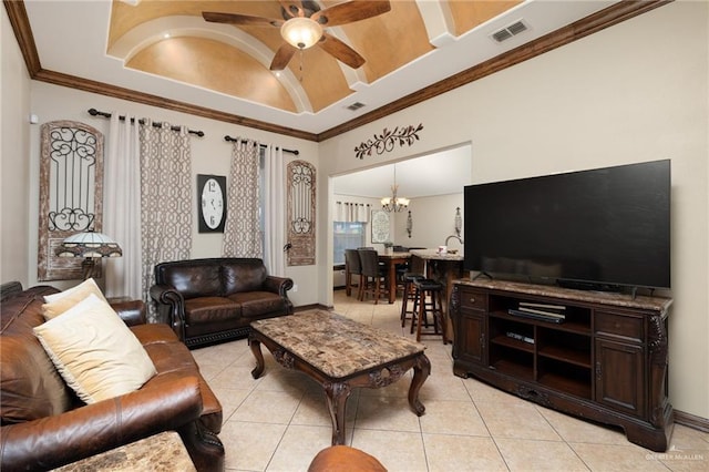 living room featuring ceiling fan with notable chandelier, light tile patterned flooring, and ornamental molding