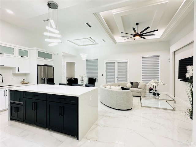 1509 Giselle St, Mission, TX 78574 - kitchen with stainless steel refrigerator with ice dispenser, dark cabinetry, white cabinets, and a sink