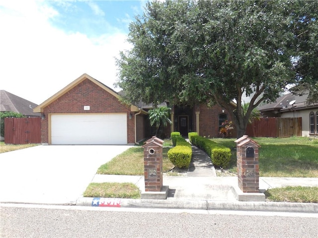 view of front facade with a front yard and a garage