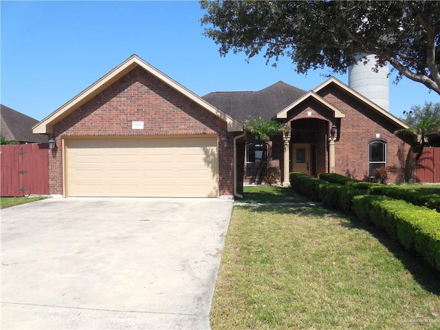 3519 Aspen Dr, Edinburg, TX 78542 - view of front of house with brick siding, an attached garage, concrete driveway, and a chimney
