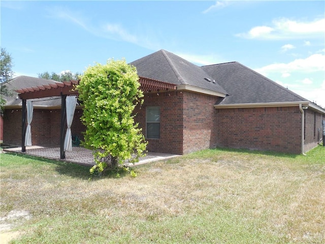 view of property exterior featuring a pergola, a lawn, and a patio