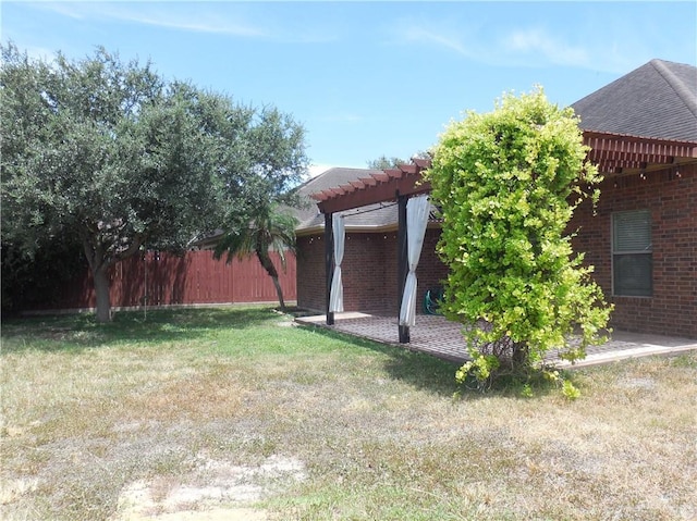 view of yard with a pergola and a patio