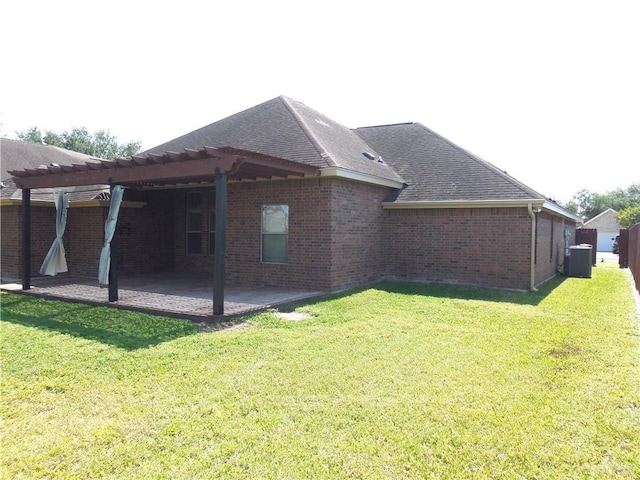 3519 Aspen Dr, Edinburg, TX 78542 - back of property with a pergola, a patio, a yard, brick siding, and roof with shingles