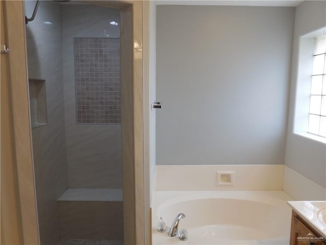 3519 Aspen Dr, Edinburg, TX 78542 - bathroom featuring a bath, vanity, and tiled shower