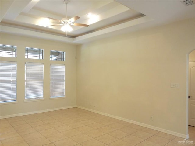 3519 Aspen Dr, Edinburg, TX 78542 - empty room with a tray ceiling, a ceiling fan, and light tile patterned floors