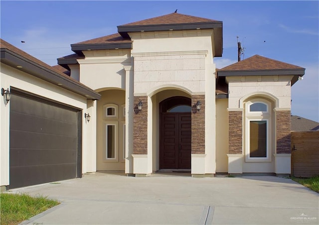 view of front of property with a garage