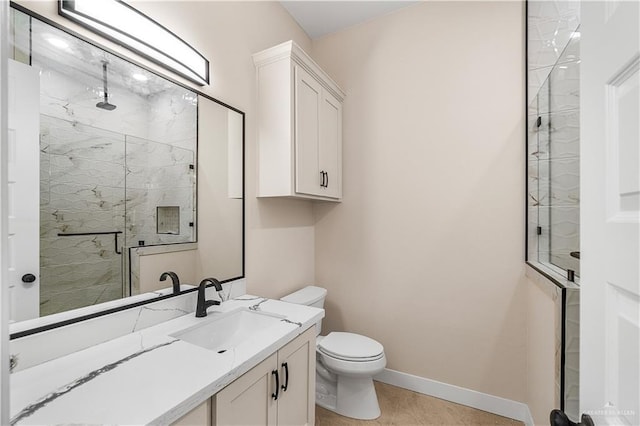 5308 N 42nd St, Mcallen, TX 78504 - bathroom featuring baseboards, toilet, vanity, a marble finish shower, and tile patterned flooring