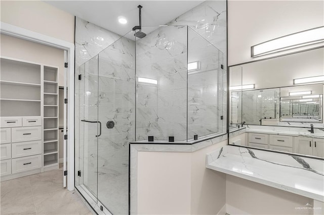 5308 N 42nd St, Mcallen, TX 78504 - bathroom featuring a marble finish shower, a spacious closet, marble finish floor, and vanity