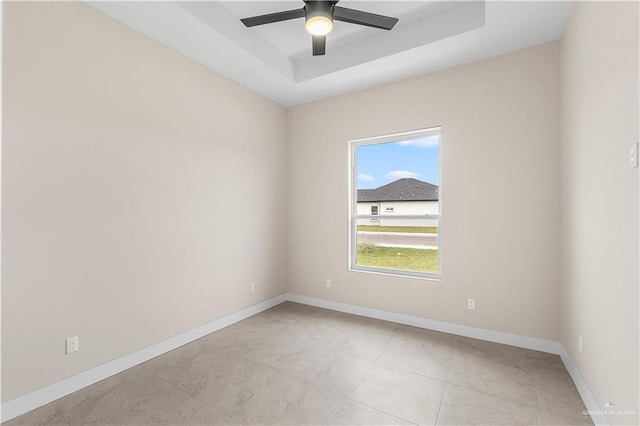5308 N 42nd St, Mcallen, TX 78504 - unfurnished room featuring a tray ceiling, ceiling fan, and baseboards