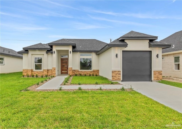 prairie-style house with a garage and a front lawn