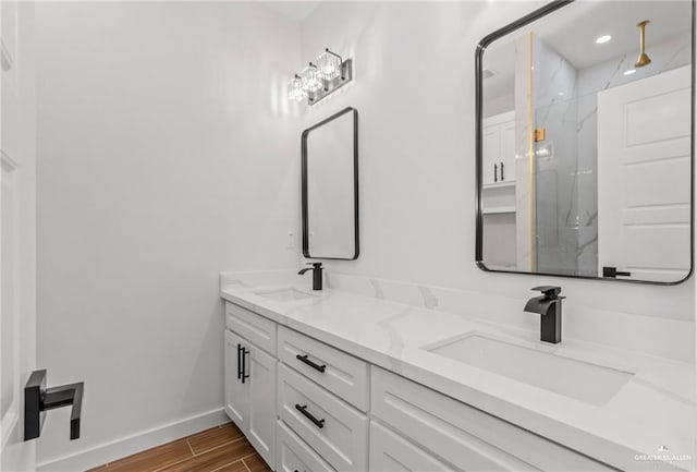 bathroom with vanity and walk in shower