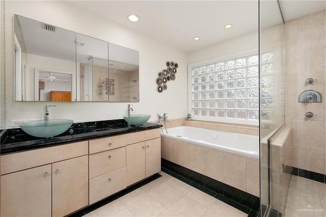 1113 Xanthisma Ave, Mcallen, TX 78504 - full bathroom with a sink, a shower stall, tile patterned floors, visible vents, and a garden tub