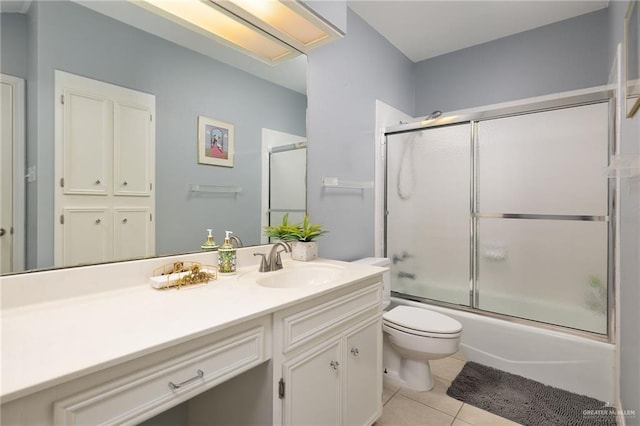 1113 Xanthisma Ave, Mcallen, TX 78504 - full bath with toilet, vanity, bath / shower combo with glass door, and tile patterned floors