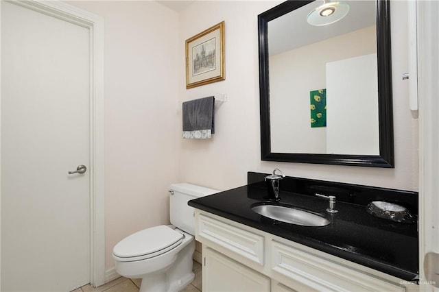 1113 Xanthisma Ave, Mcallen, TX 78504 - half bath featuring toilet, vanity, and tile patterned flooring