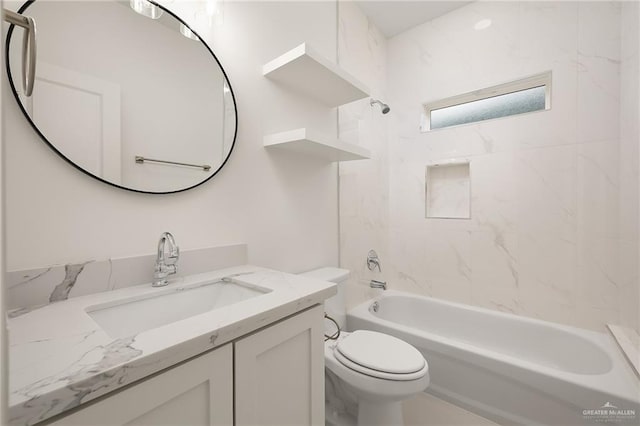 full bathroom with tiled shower / bath combo, toilet, and vanity