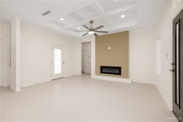 unfurnished living room featuring ceiling fan, beamed ceiling, light tile patterned flooring, and coffered ceiling