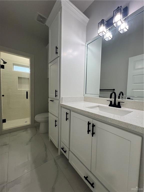 bathroom featuring vanity, an enclosed shower, and toilet