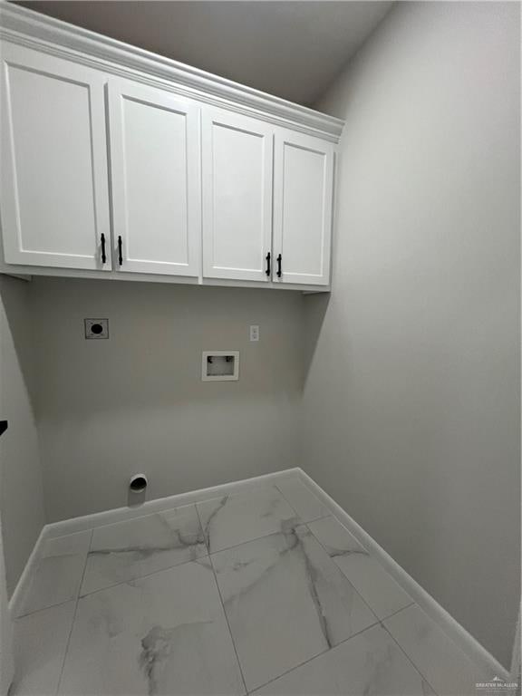 laundry room featuring cabinets, washer hookup, and electric dryer hookup