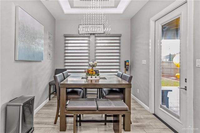 dining room with a wealth of natural light and an inviting chandelier