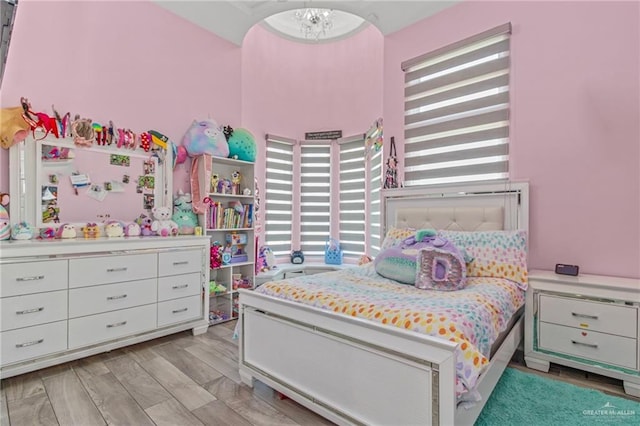 bedroom featuring an inviting chandelier